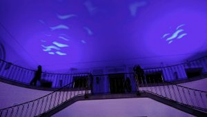 The University main hall illuminated in blue to match up with the event's theme: Water